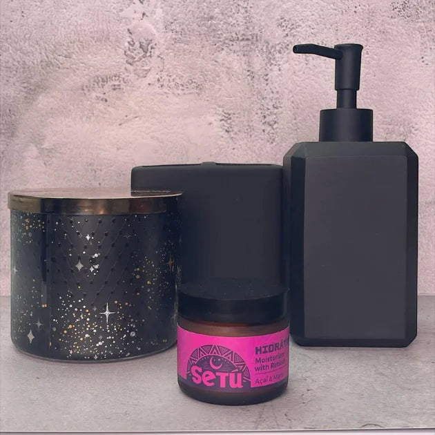 Setu skincare products including a jar, bottle, and container on a textured surface.
