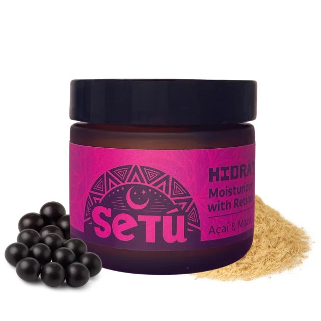 Jar of Setu product with acai berries and maca powder on a white background