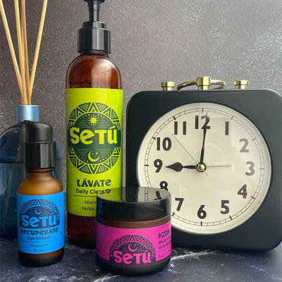 Setu skincare products including bottles and a jar with a clock in the background.