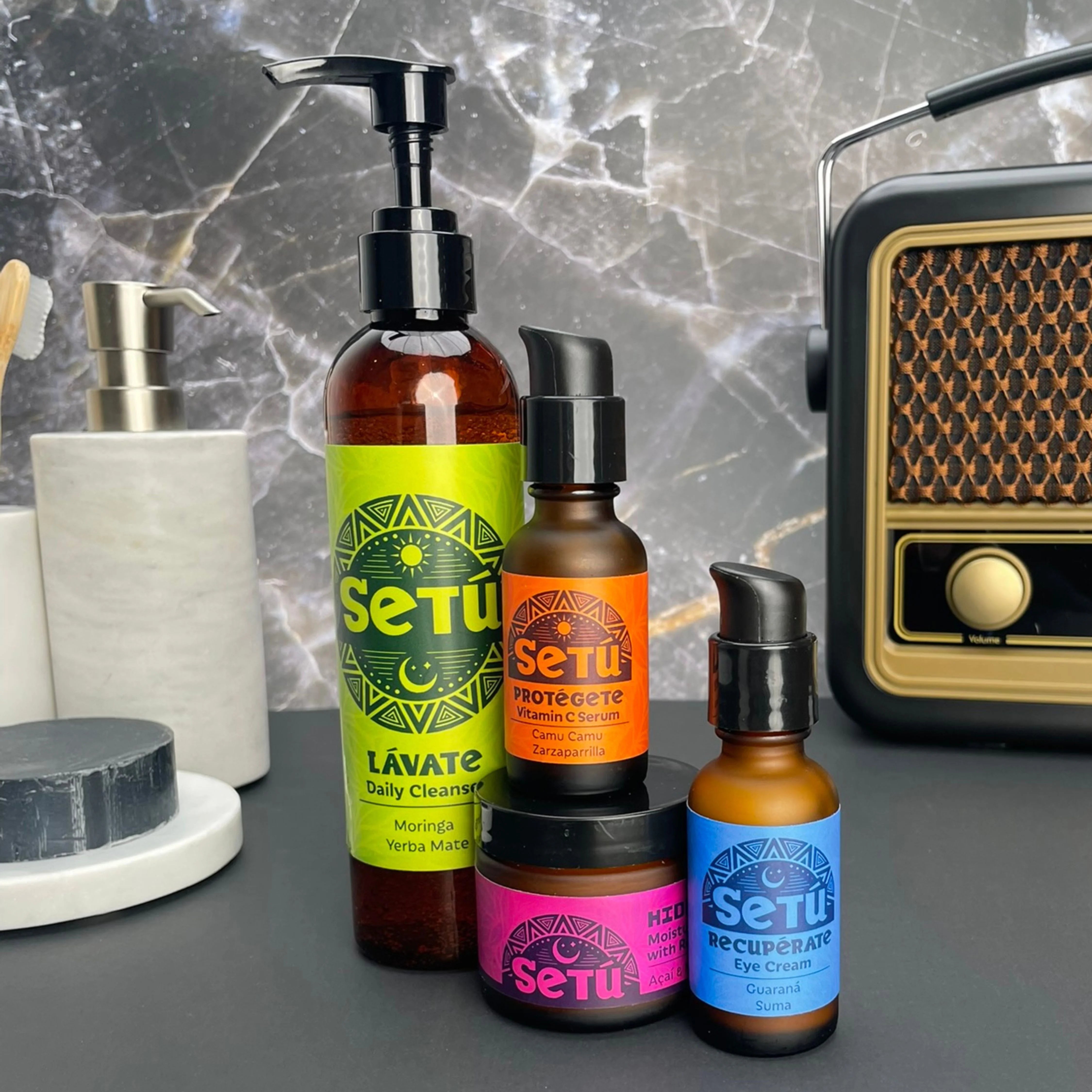 Skincare set with cleanser, vitamin C serum, mask, eye cream, and eye serum.
