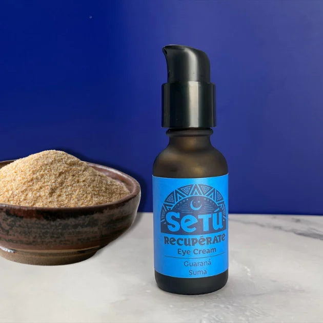 Bottle of Setu Eye Cream with a bowl of powder on a blue background