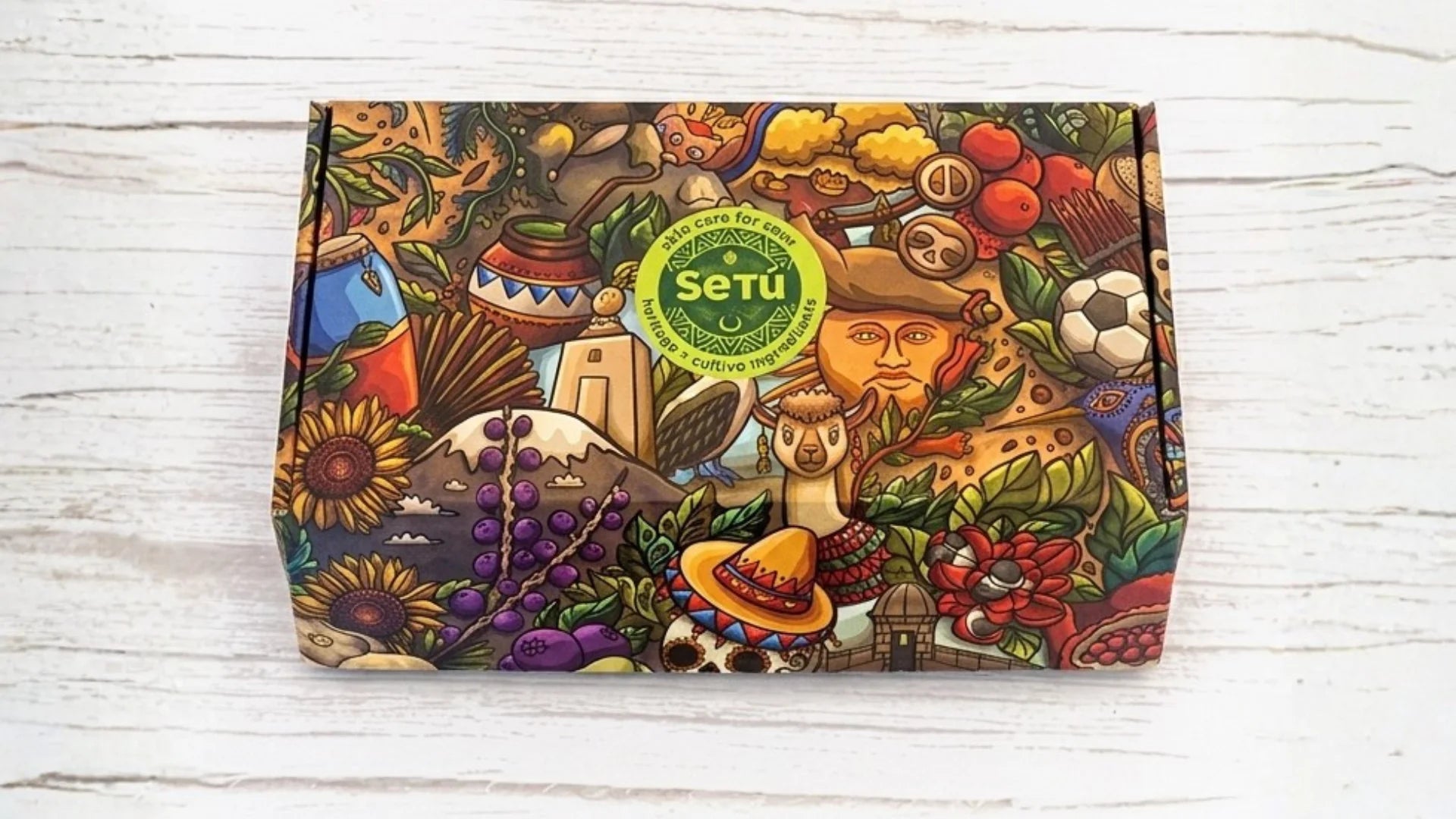Setu Skincare Colorful box with various designs and a visible brand logo on a wooden surface