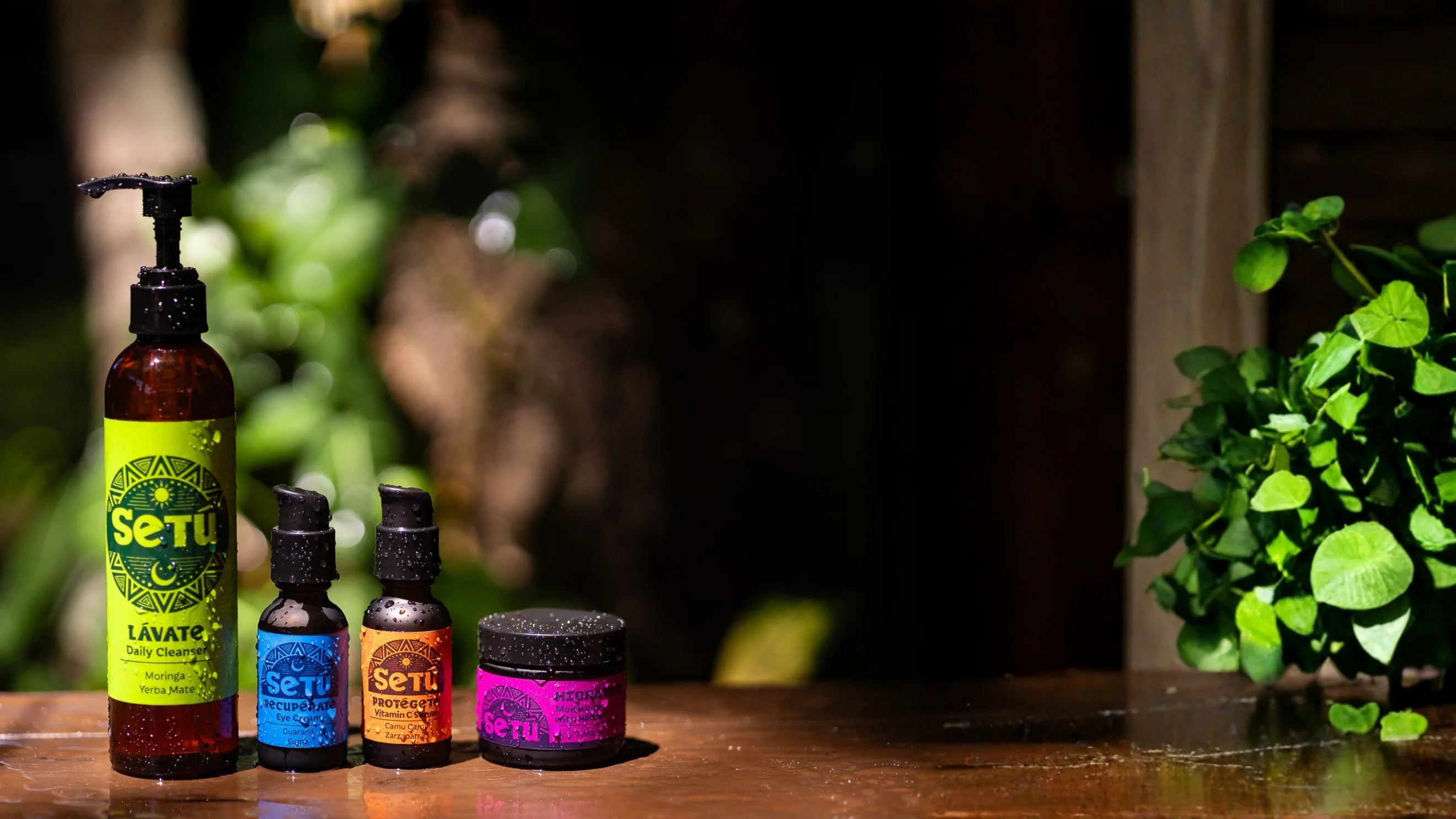 Set of Setu skincare products on a wooden surface with greenery in the background