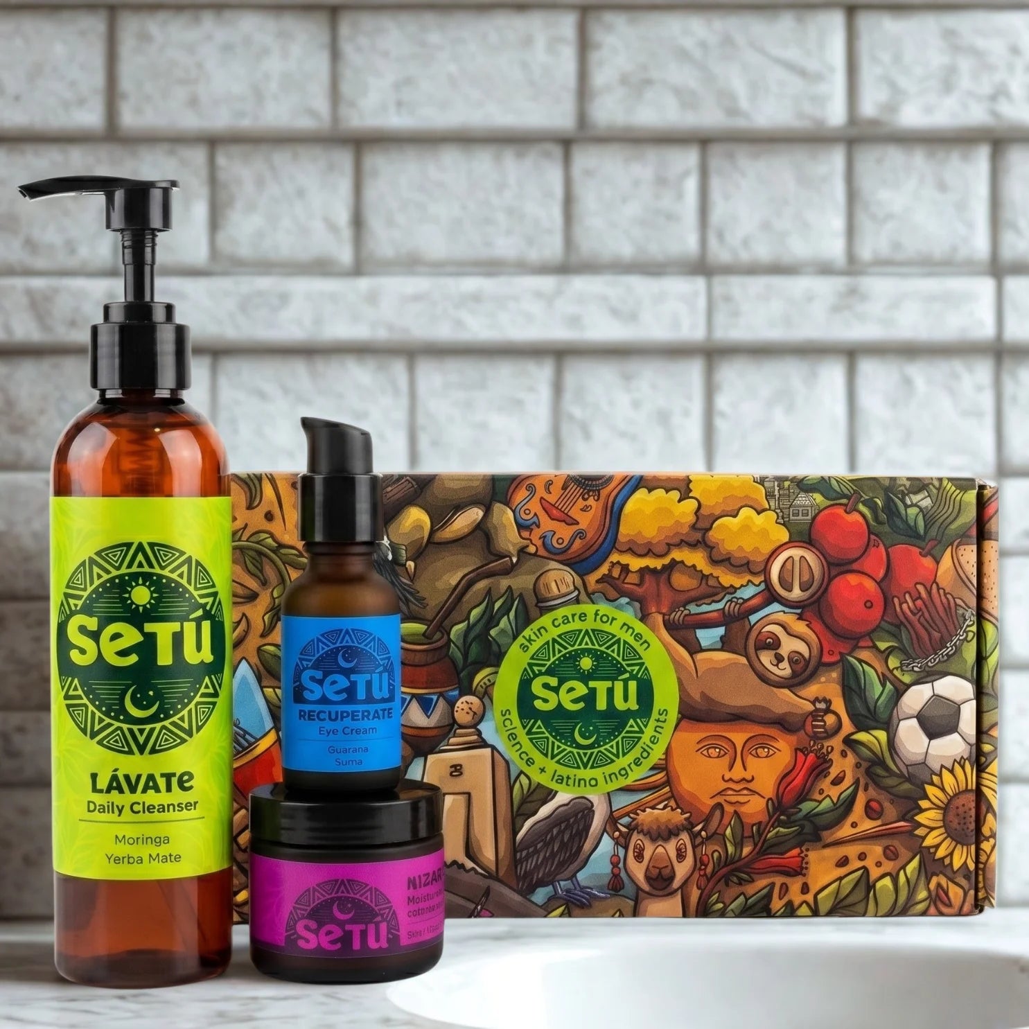 Skincare gift set with pump cleanser, small bottles, and a patterned night routine box