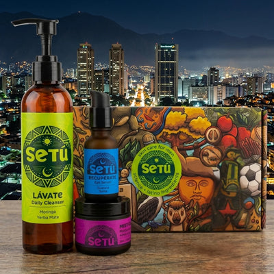 Skincare gift set with three bottles and a patterned night routine box